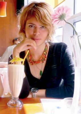Smart, sexy Russian woman in a cafe