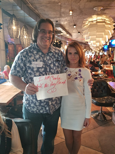 Charlie with a lady that had a Kathy Ireland look
