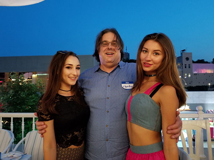 Western man meeting two beautiful women