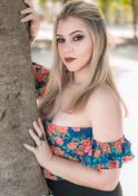 blonde Brazilian girl beside the tree pictorial