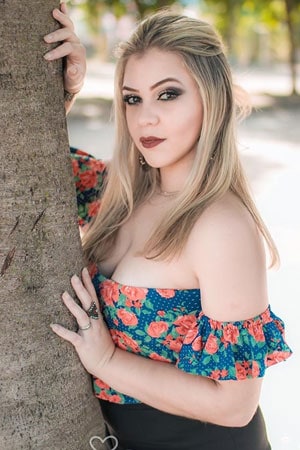 blonde Brazilian girl beside the tree pictorial