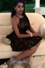 classy Dominican girl sitting on the couch