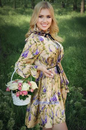 cute Moldovan fitness trainer in a floral dress