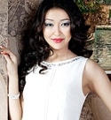 attractive Kazakhstani wearing a simple white dress