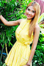cute Thai babe in a sunny yellow dress