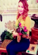 Kazakh woman holding a bunch of flowers