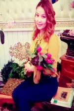 Kazakh woman holding a bunch of flowers
