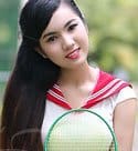 ravishing Viet girl with a tennis racket