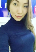 single Kazakh woman in blue turtleneck