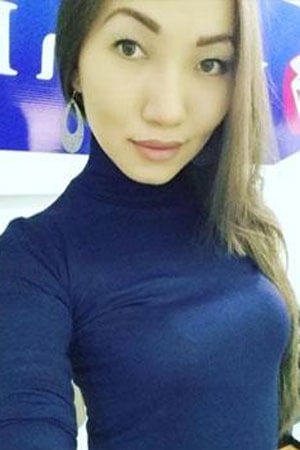 single Kazakh woman in blue turtleneck