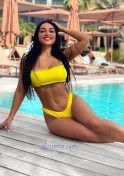 Ukraine fitness trainer in yellow bikini at the pool