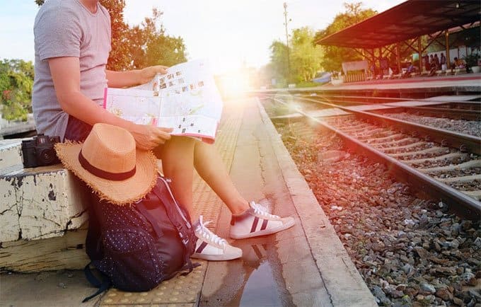 a travelling man looking at a map