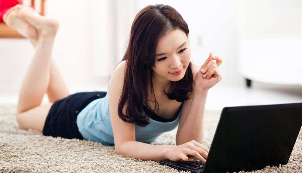 Asian girl in front of a laptop