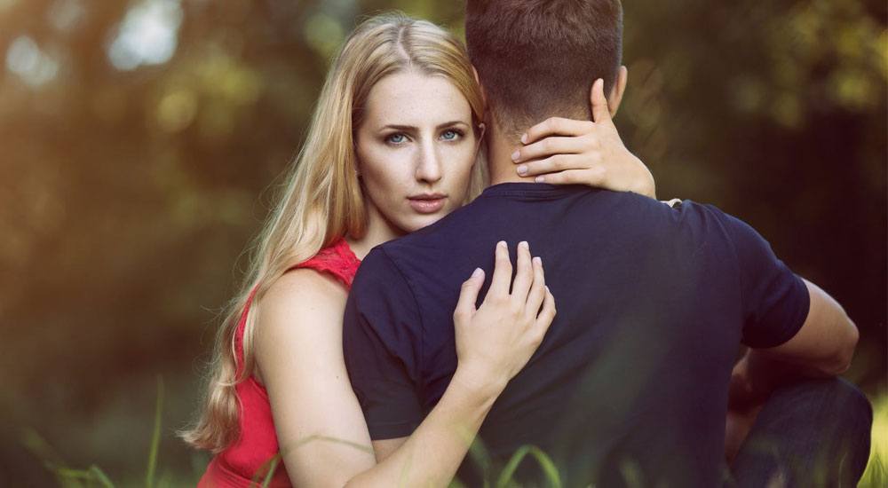 blonde girl hugging her man