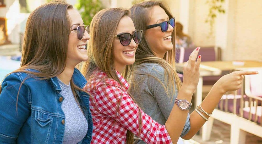 happy Russian girls wearing sunglasses