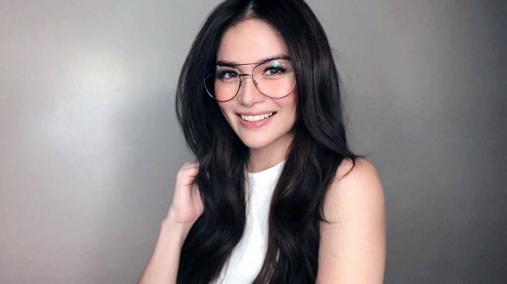 smart Filipina girl wearing glasses