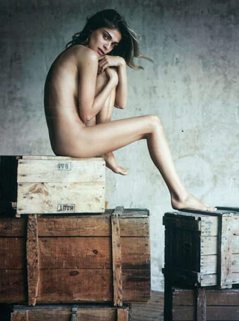 Elisa Sednaoui nude sitting on a crate