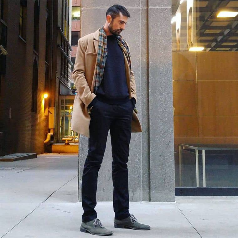 tall guy standing beside a building