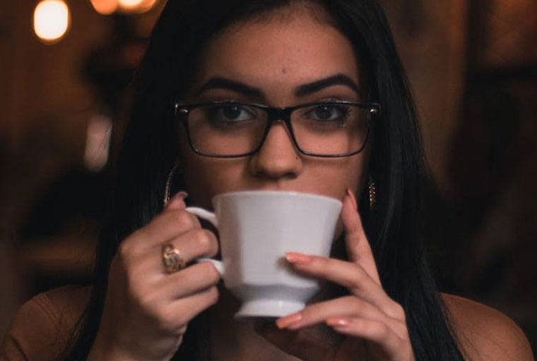 confident girl drinking coffee