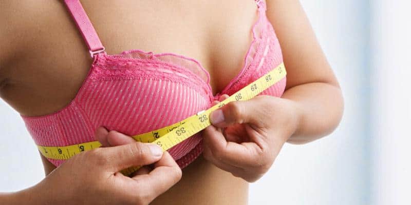 girl measuring breast
