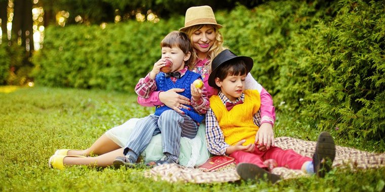 mom with sons at the park