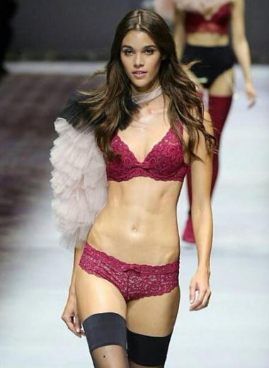 Pauline Hoarau wearing maroon lingerie at the catwalk