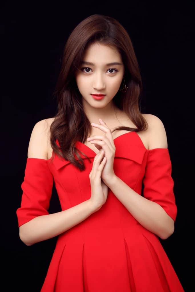 Guan Xiaotong wearing elegant red dress