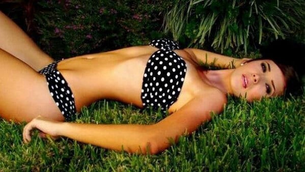 Kimberly dos Ramos laying on the grass