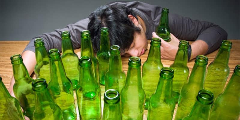 man passed out because of excessive drinking