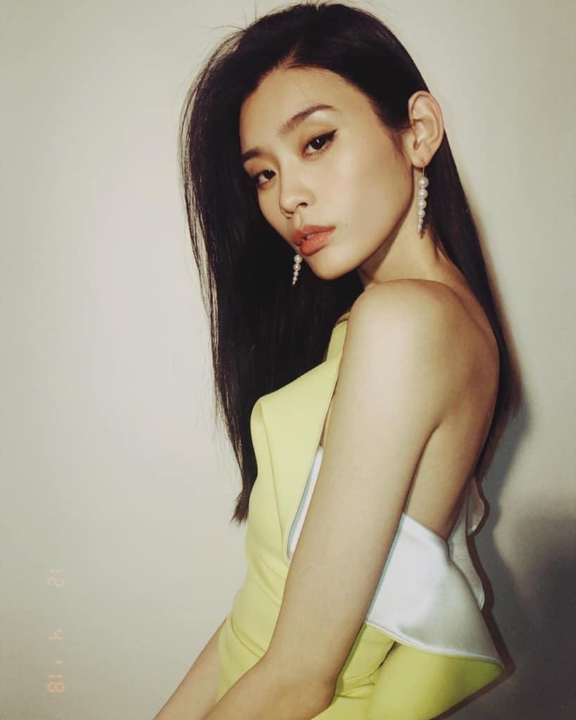 Ming Xi seductive in a yellow dress