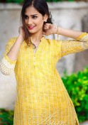 sultry Indian girl in a nice yellow dress