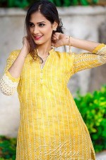 sultry Indian girl in a nice yellow dress