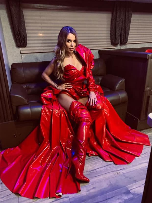 Doda wearing an all red dress backstage