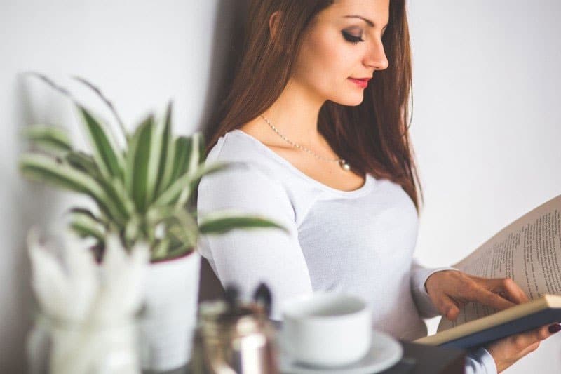 pretty woman reading a book