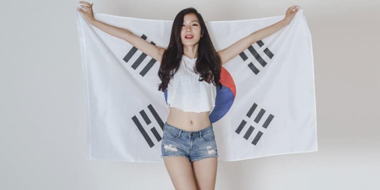 cute Korean girl holding a korean flag