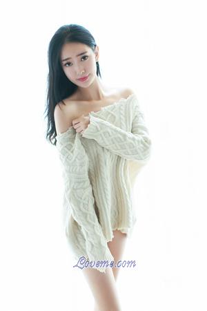 appealing Chinese babe in a sweater