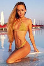 Ukrainian dance teacher in gold bikini